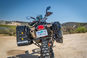 Picture showing SE-4050 Hurricane Adventure Saddlebags - mounted to KTM 690, one expanded and one compressed